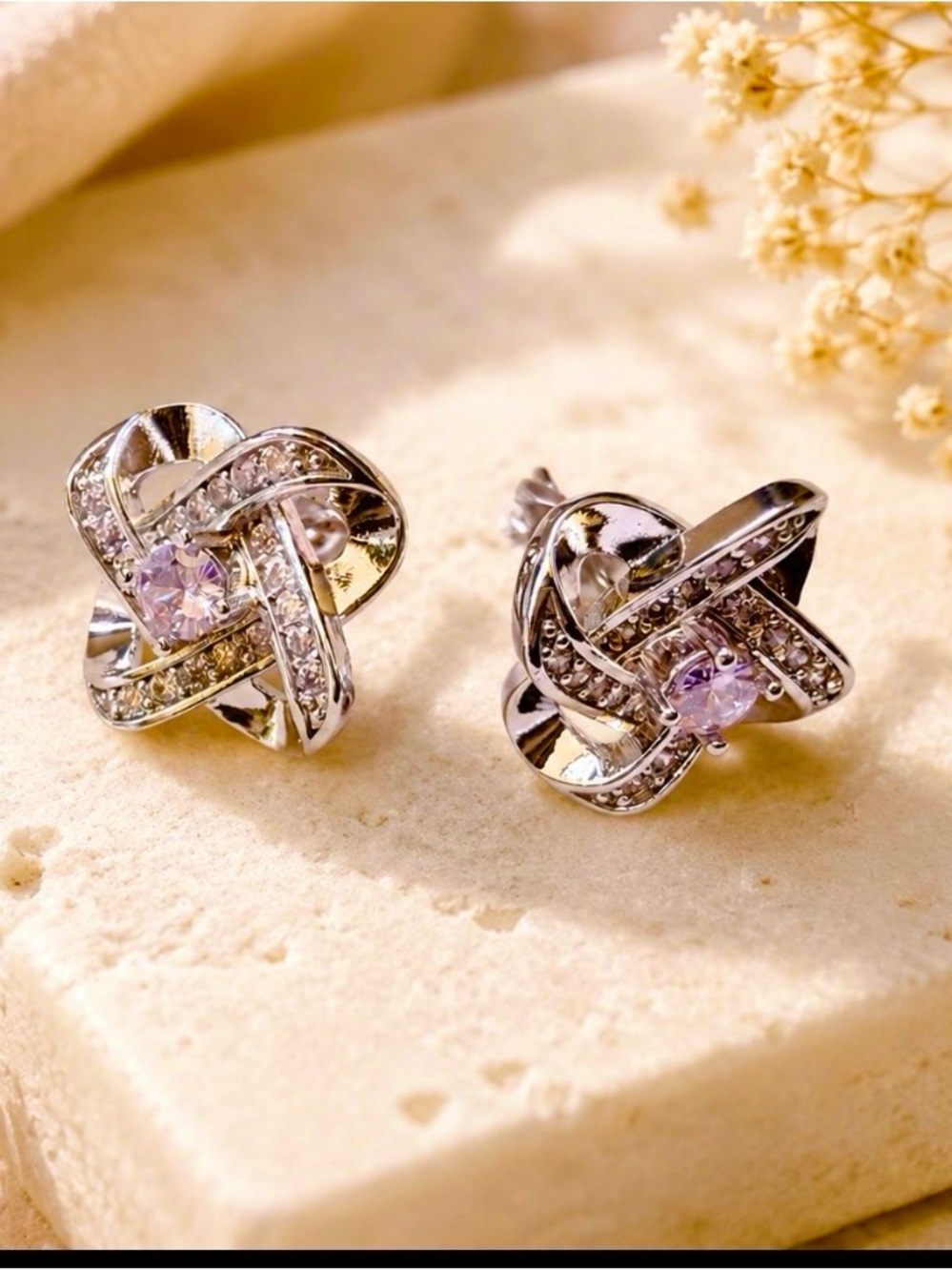 Silver Tone Knot Stud Earrings With Amethyst Color Stone